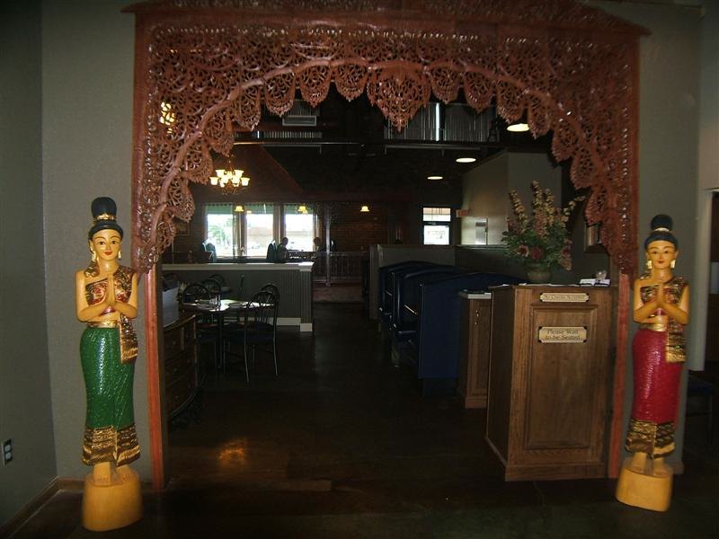 The carved archway and welcoming statues at the entrance