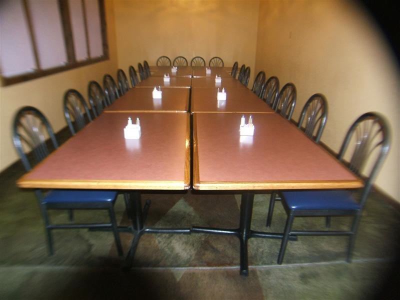 A private room set banquet-style for a large group